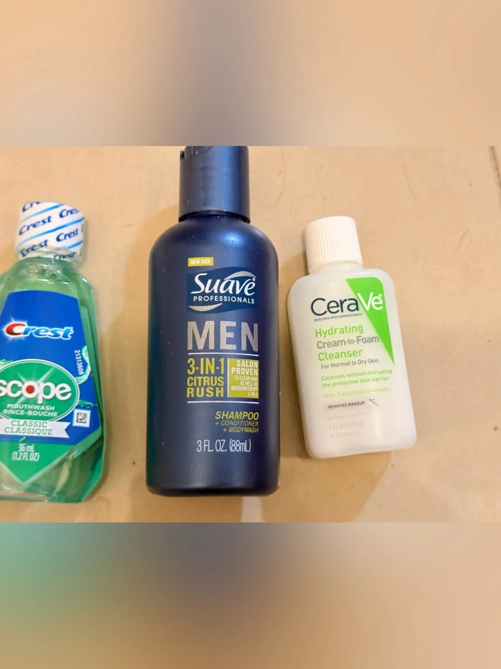 Travel size toothpaste, mouthwash, cerave hydrating cream and suave shampoo